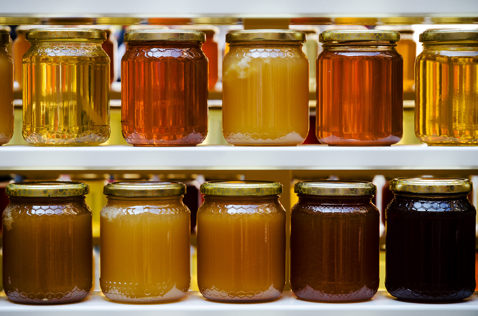 Jars of honey and jam on shelves