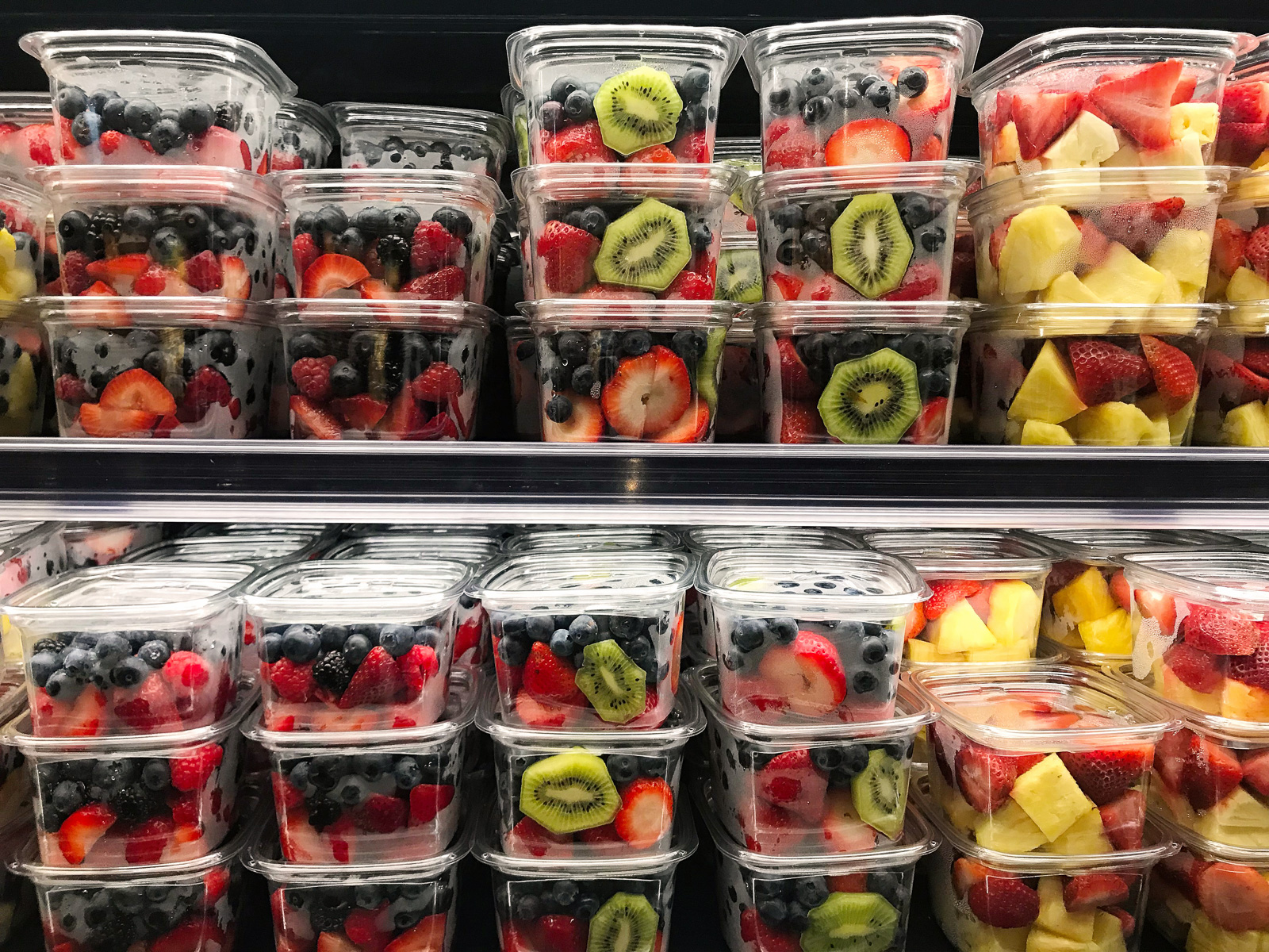 Packaged fresh fruit on shelves